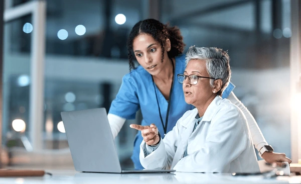doctors-nurse-laptop-night-healthcare-600nw-2256248491